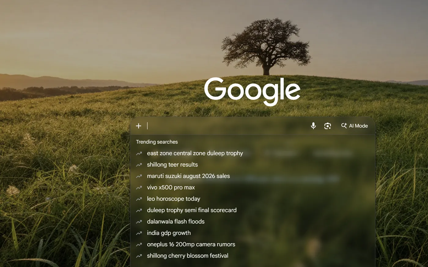 A grassy hill at dusk behind Google, with the search suggestions on a panel of frosted glass that lets the wallpaper show through.